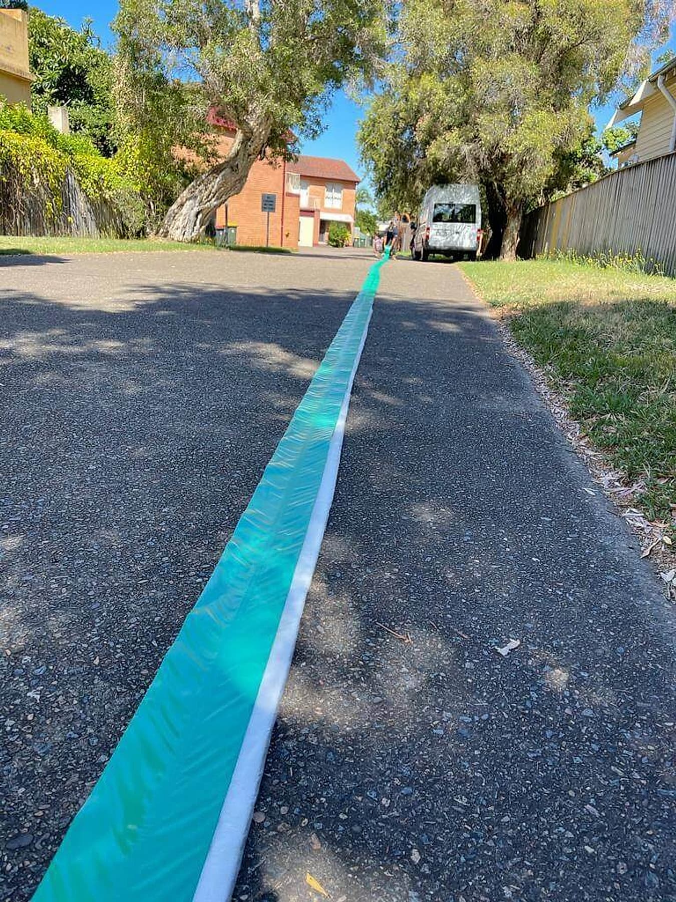 Pipe relining setup beside established gardens at a Baulkham Hills property