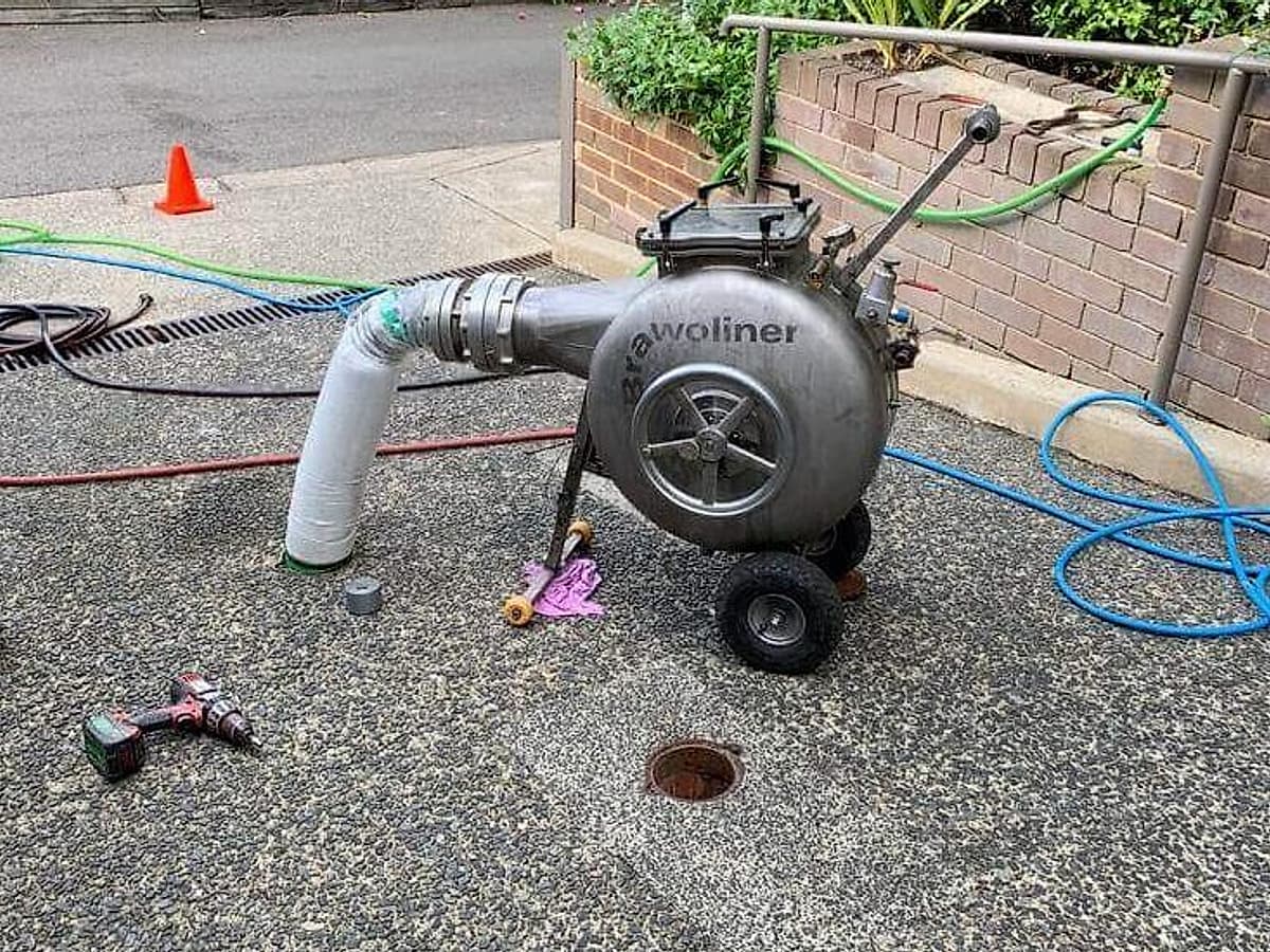 Drain relining liner being prepared before installation